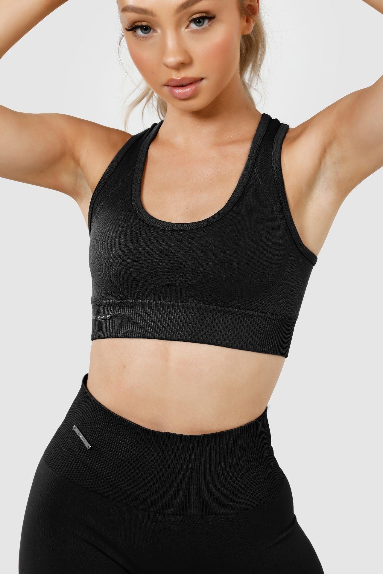 Close up girl wearing invctus seamless crop in black, front
