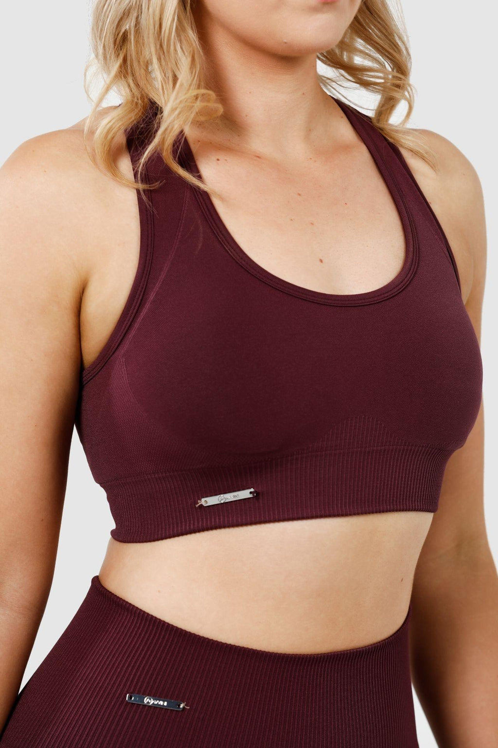 Close up girl wearing invictus seamless crop in plum purple
