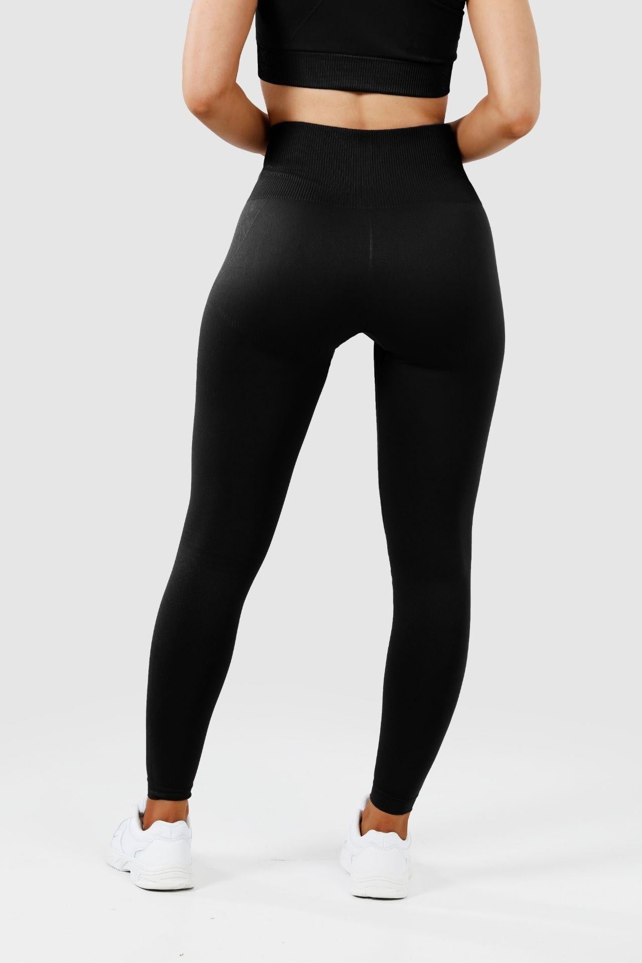 Girl wearing invictus seamless leggings in black, back