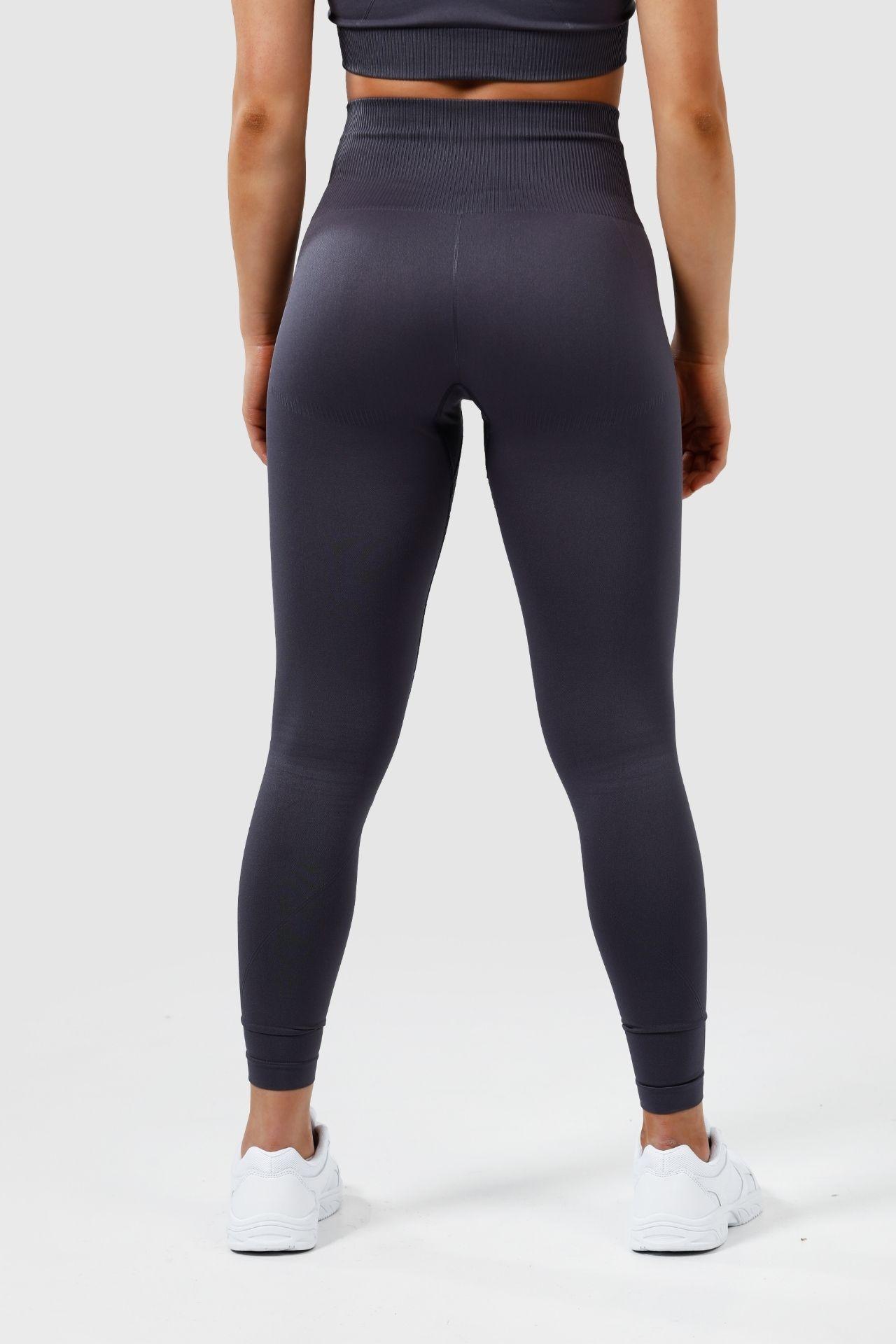 Girl wearing invictus seamless leggings in charcoal back