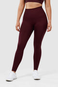 girl wearing invictus seamless leggings in plum purple front
