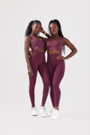 girl wearing invictus seamless leggings in plum purple front