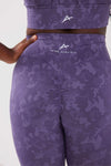 girl standing one hand on hip wearing legacy scrunch bum leggings in purple