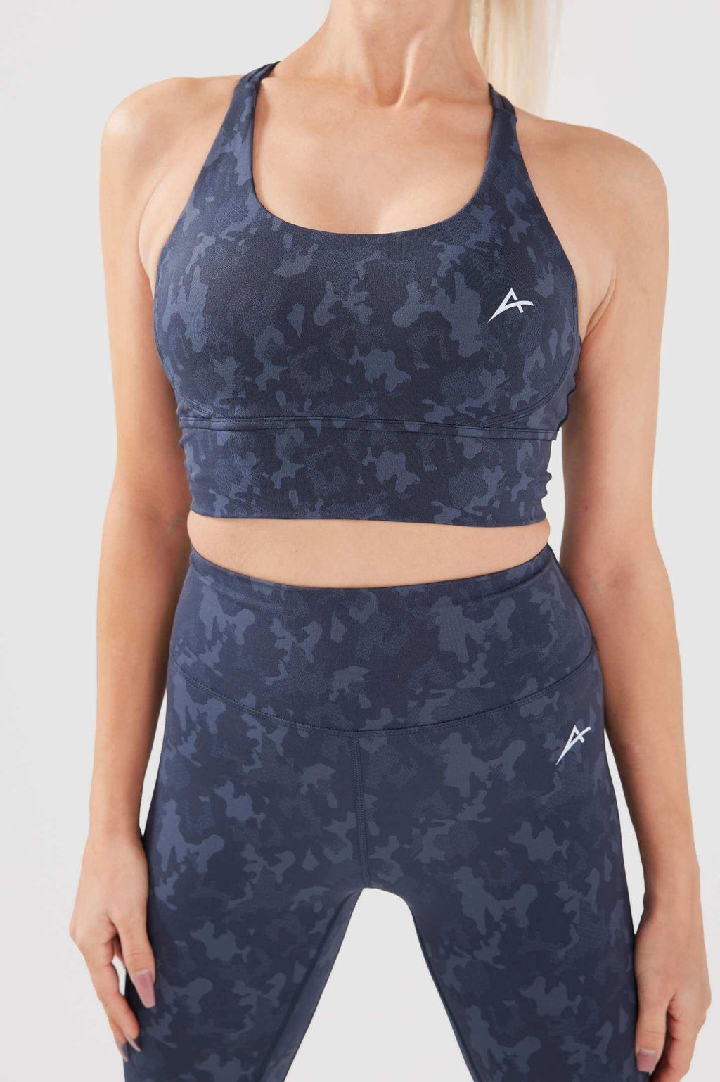 Front girl wearing charcoal legacy set