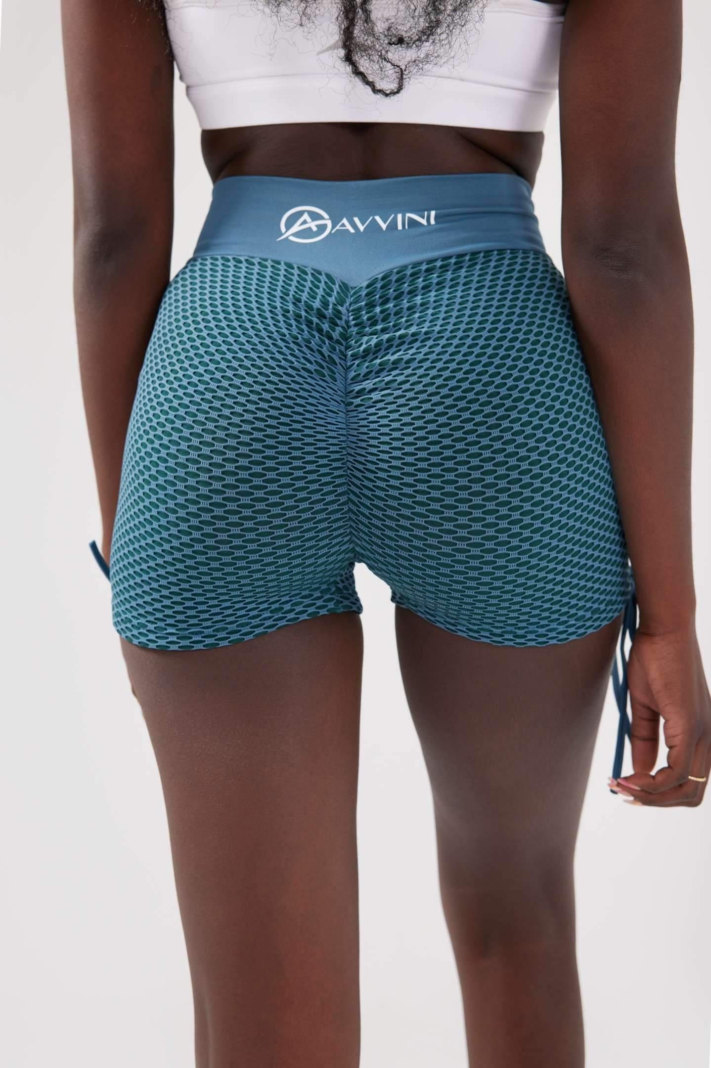 Close up girl wearing blue luna scrunch bum shorts behind