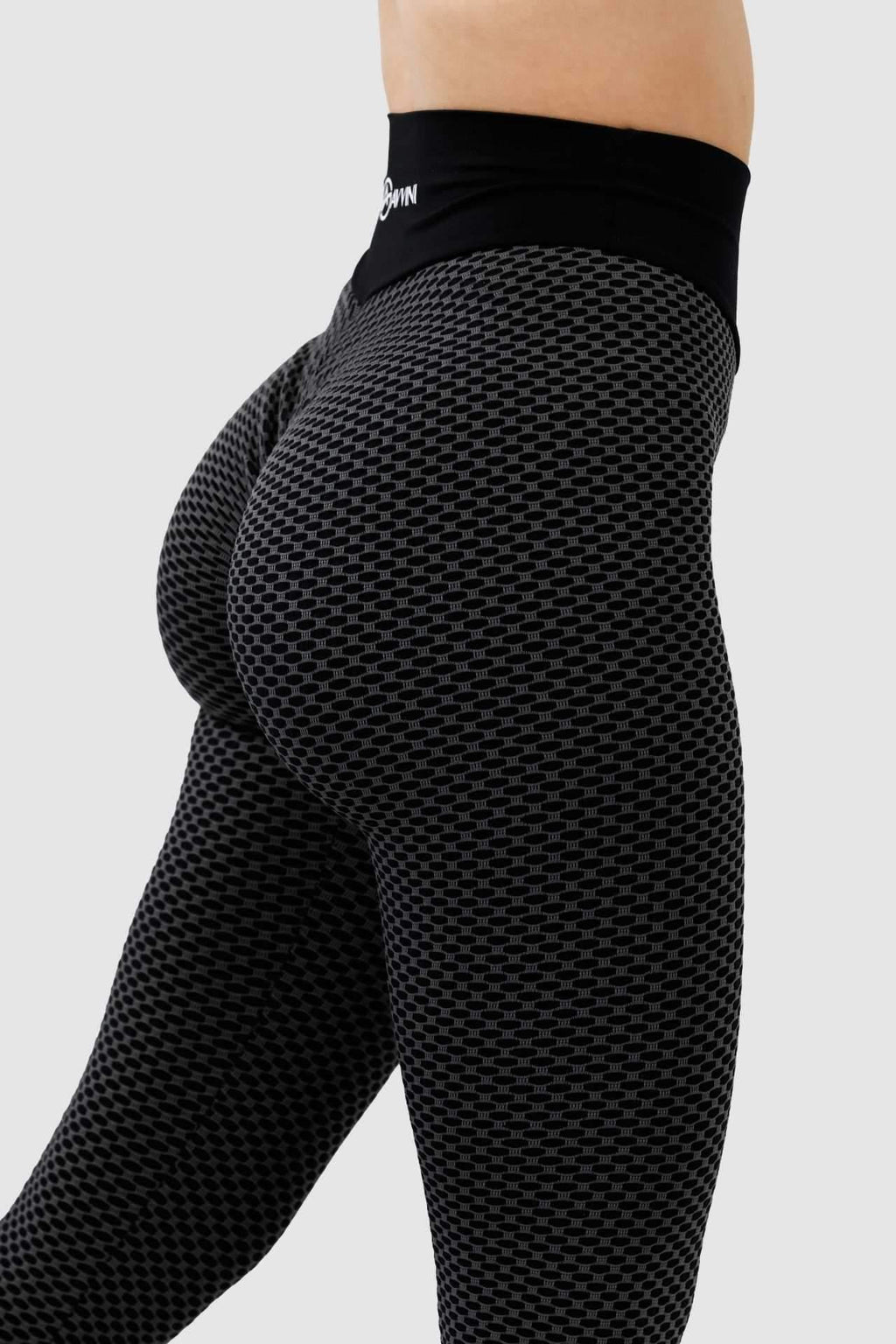 Close up girl wearing black luna scrunch bum leggings side