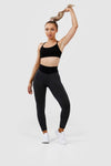 Girl wearing black luna scrunch bum leggings hands on hips 
