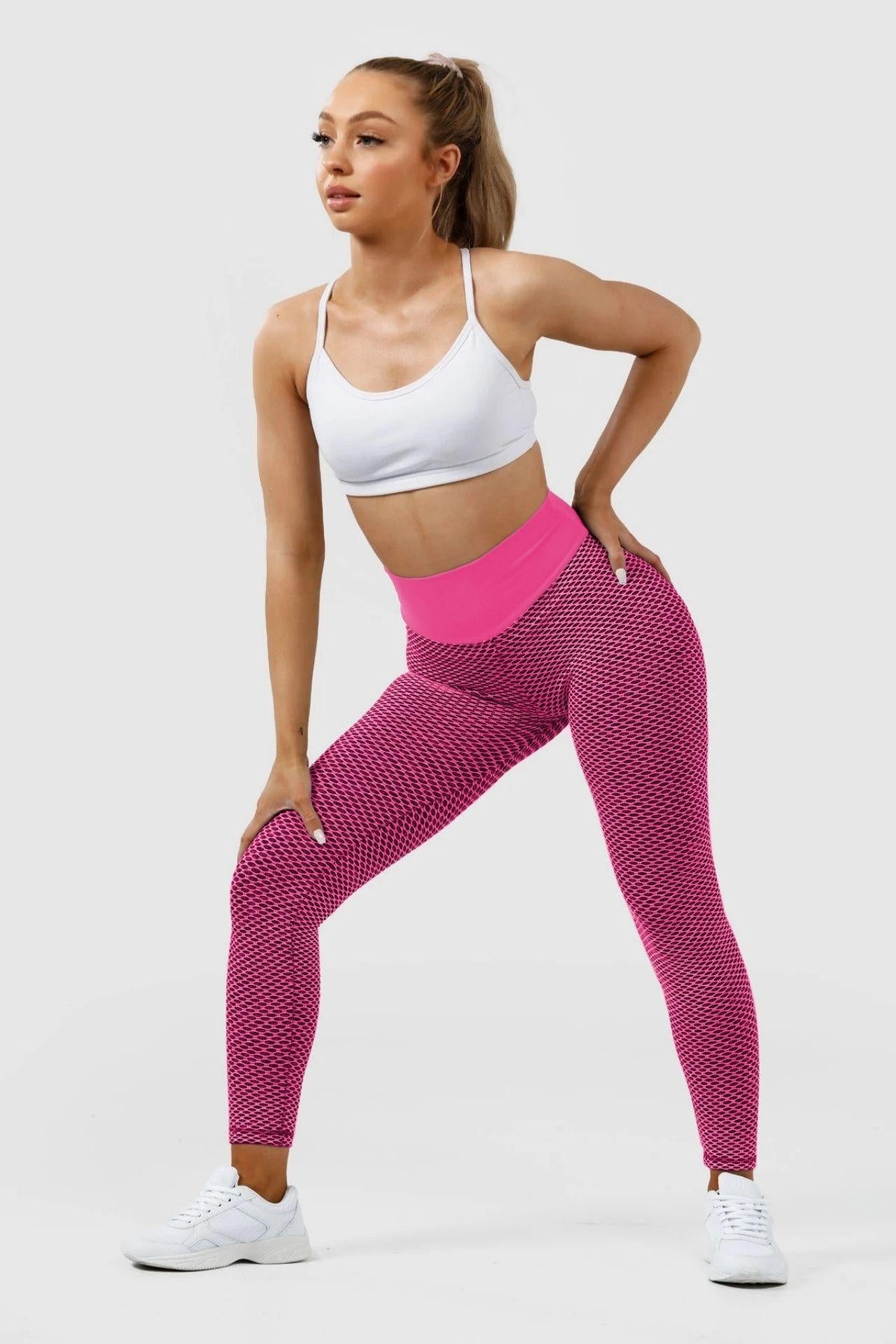 Girl posing wearing pink luna scrunch bum leggings