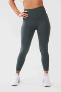 Close up girl wearing khaki luna x seamless scrunch bum leggings hand on hip front