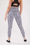 Close up girl hands in pockets wearing leopard luxe scrunch bum pocket leggings side