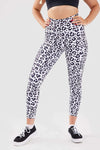 Close up girl hands in pockets wearing leopard luxe scrunch bum pocket leggings side