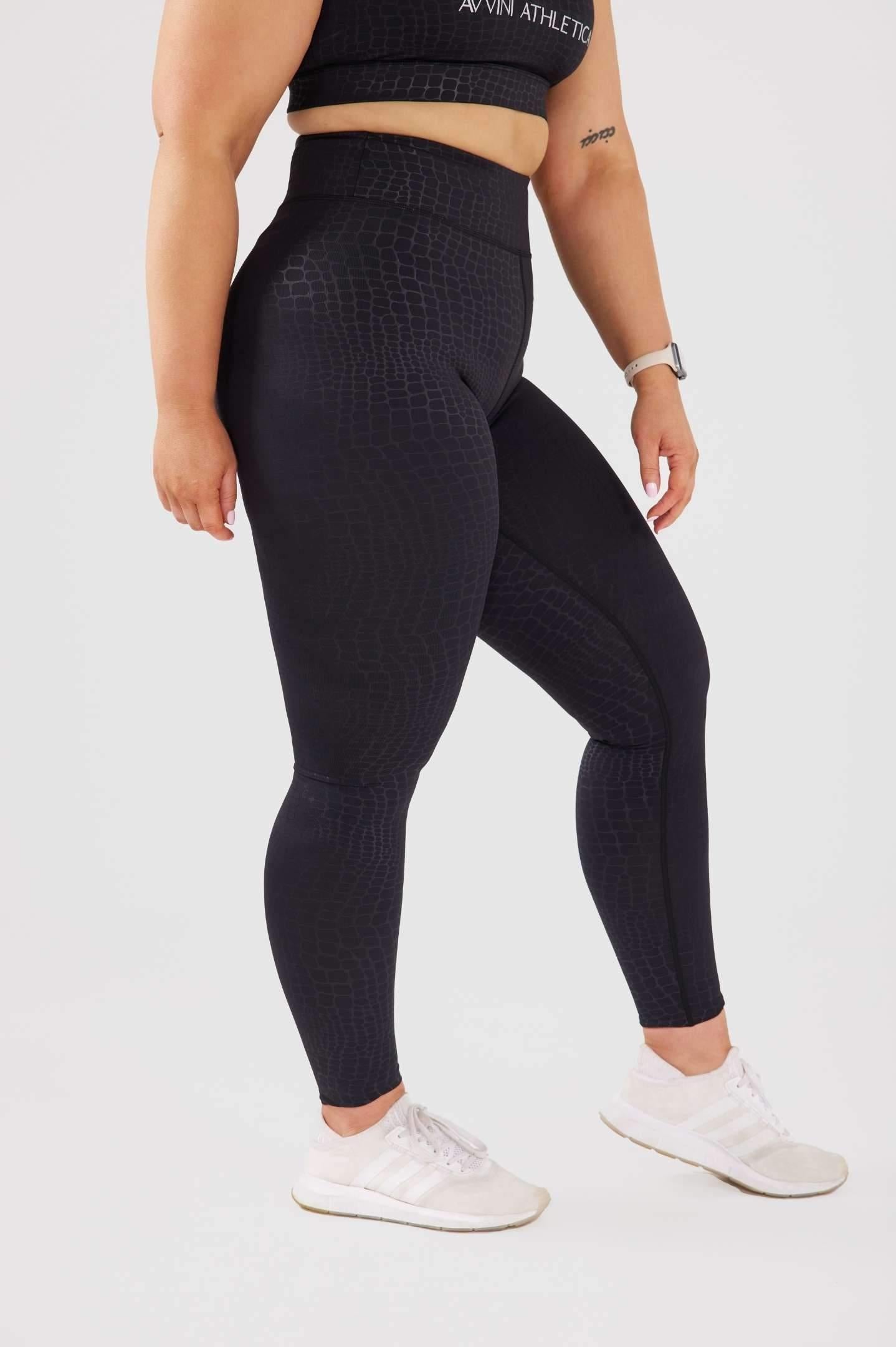 close up girl wearing luxe snake print leggings side 