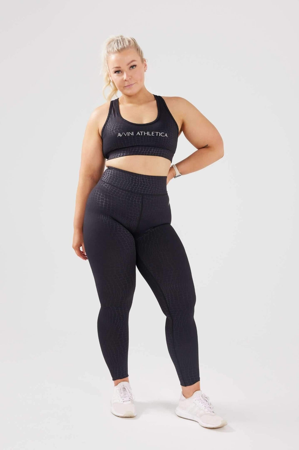 Girl posing hand on hip wearing luxe snake print set front