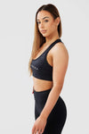 girl posing hands on hips wearing luxe snake print crop top front