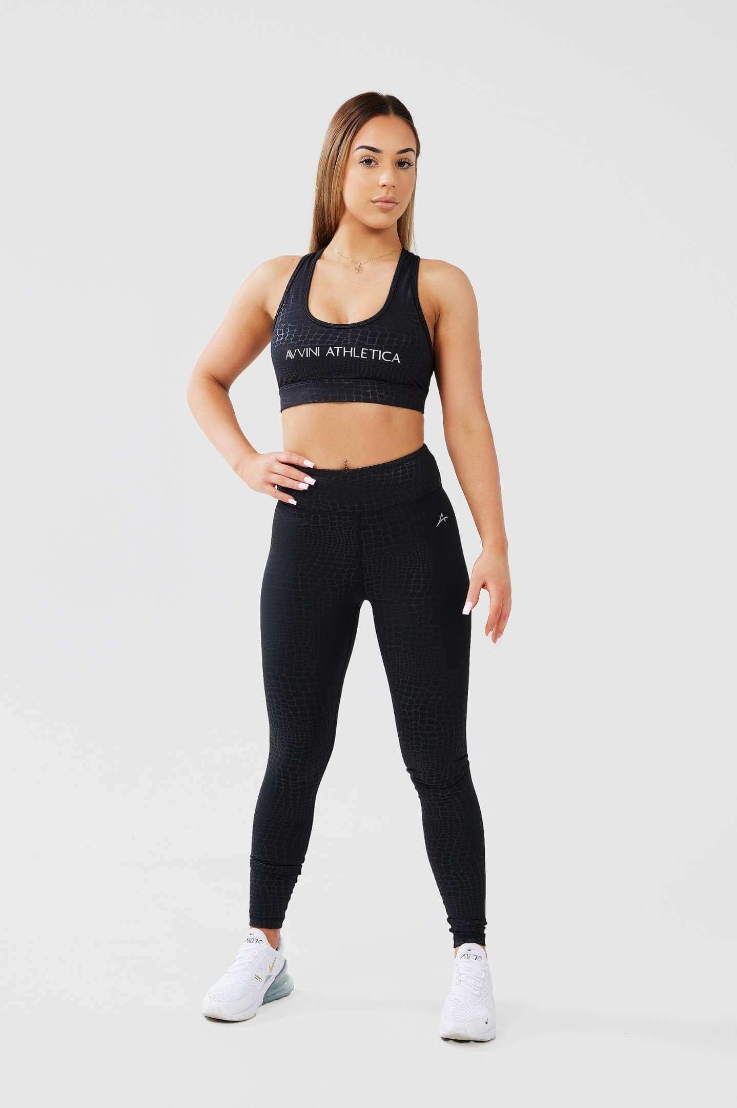 Girl posing hand on hip wearing luxe snake print set front