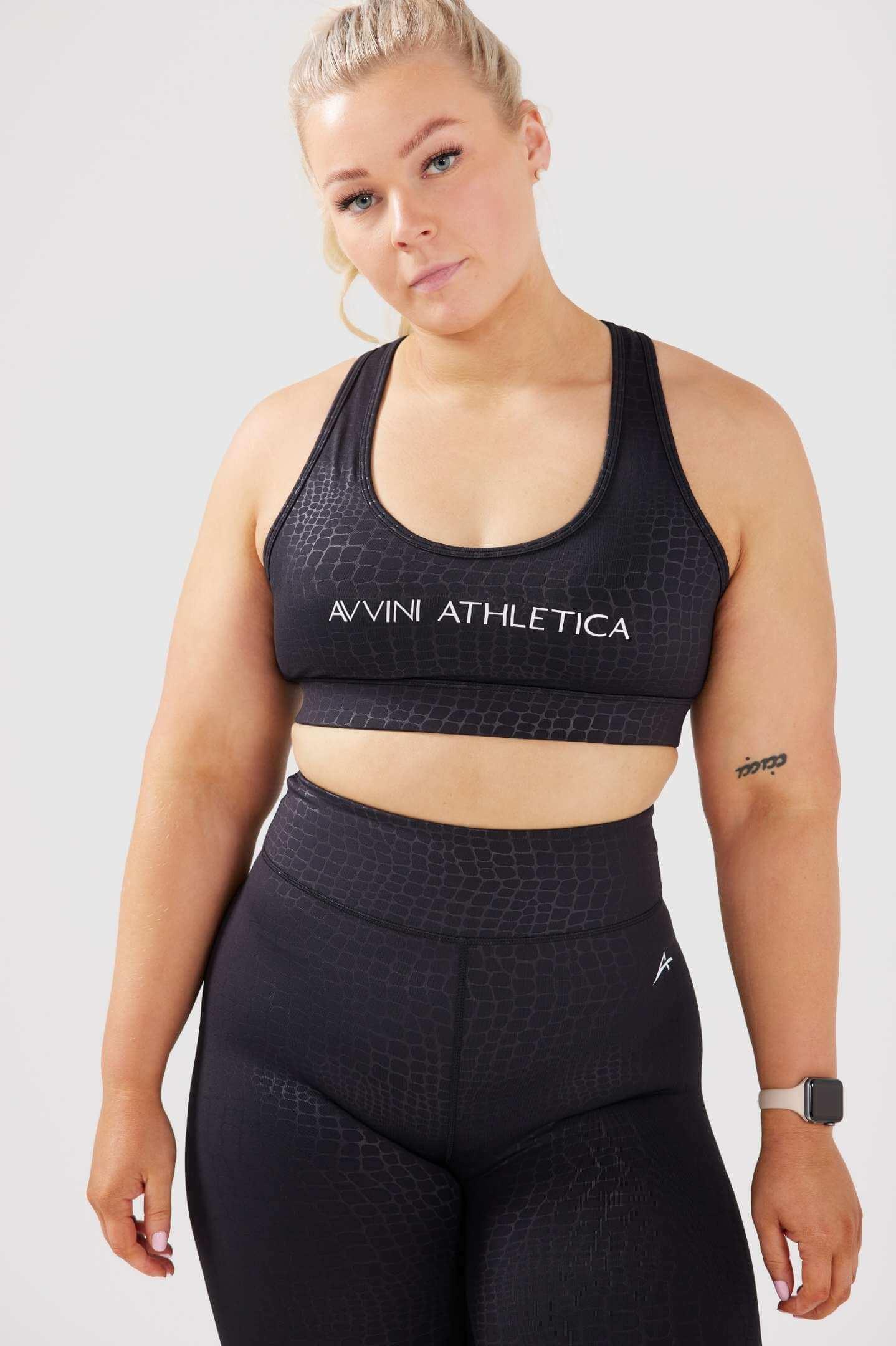 Girl wearing luxe snake print set front 