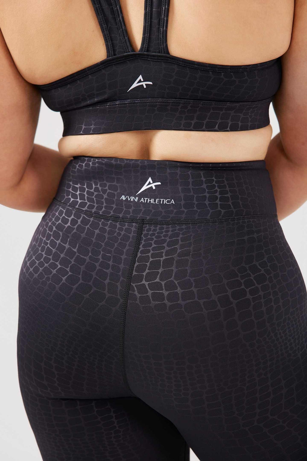 Close up girl wearing luxe snake print set back